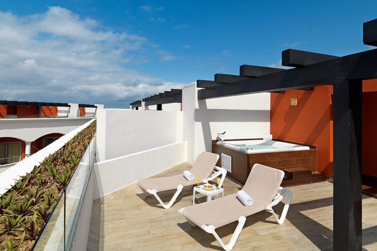 A Rock Platinum Sky Suite terrace balcony with lounge chairs.