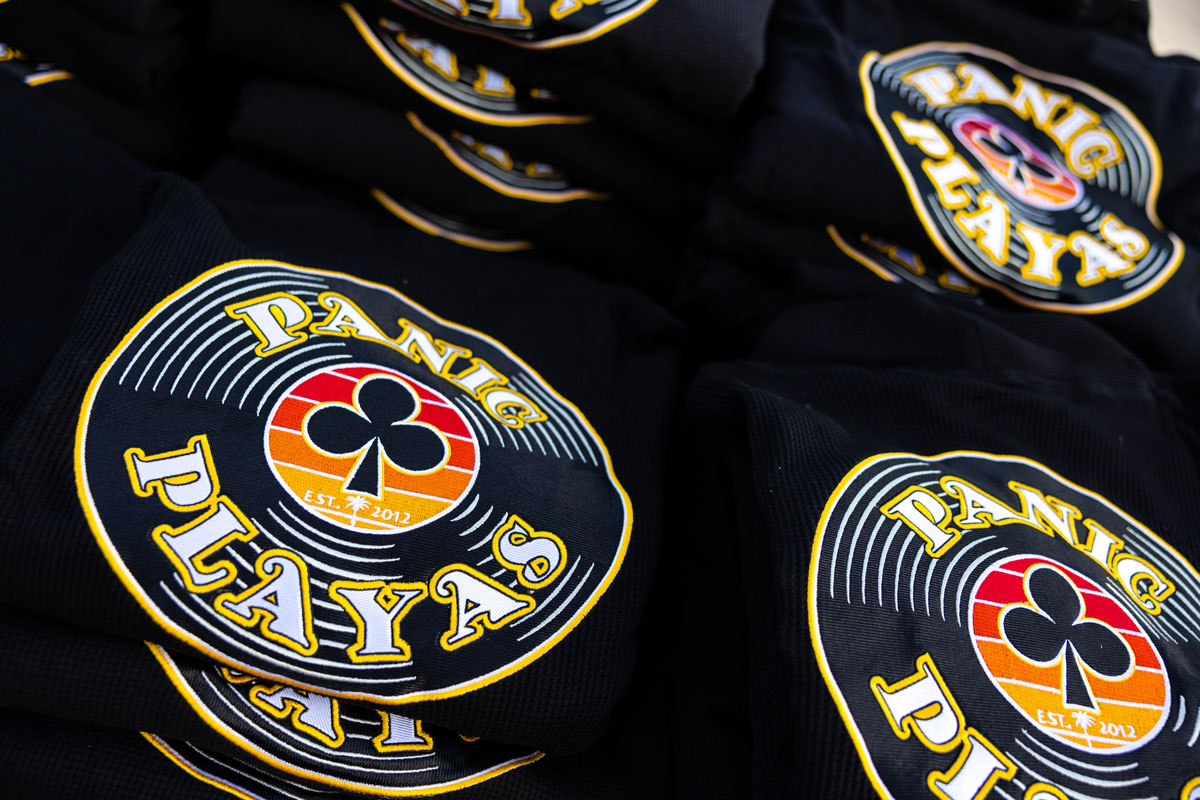 A close up of the "Panic Playas" logo featured on the back of the loyalty club robes.
