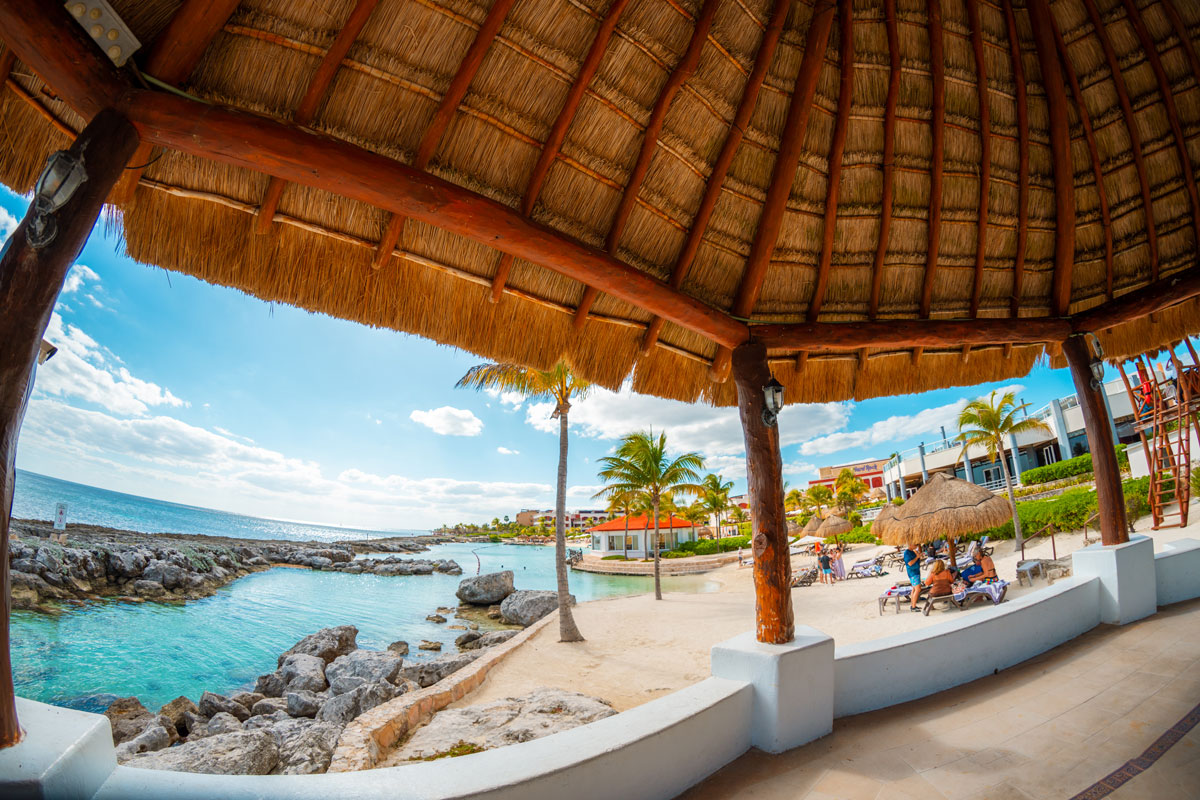 Beach lagoon view from under a palapa.