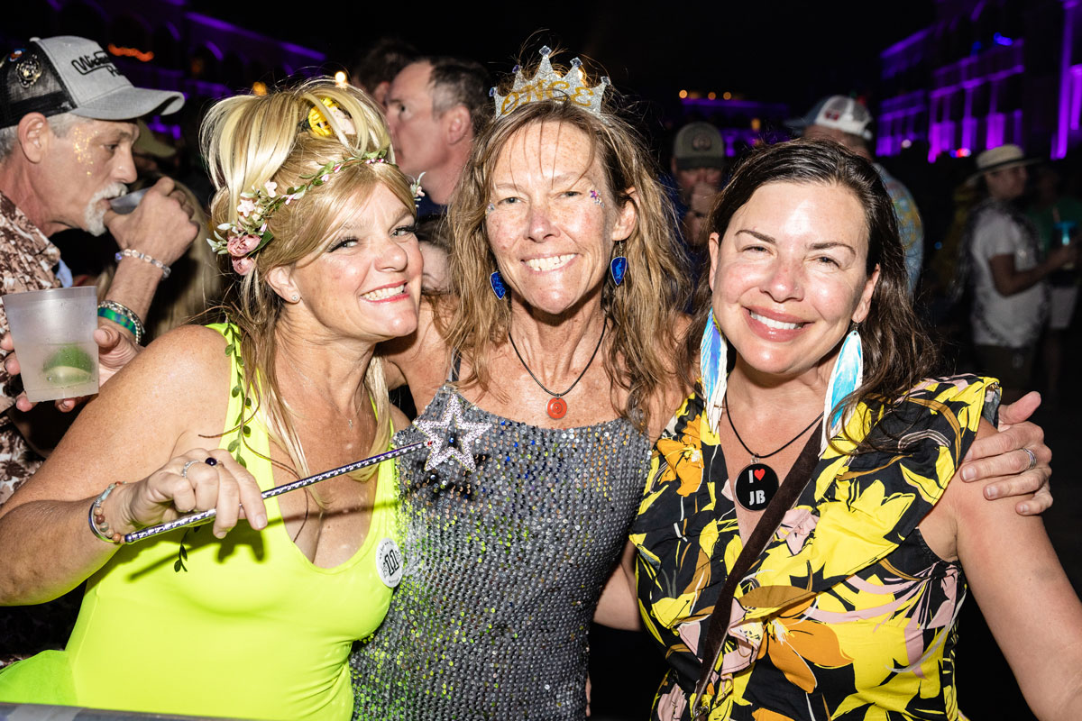 Guests posing in theme night costumes.