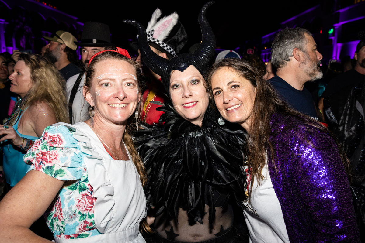 Guests posing in theme night costumes.
