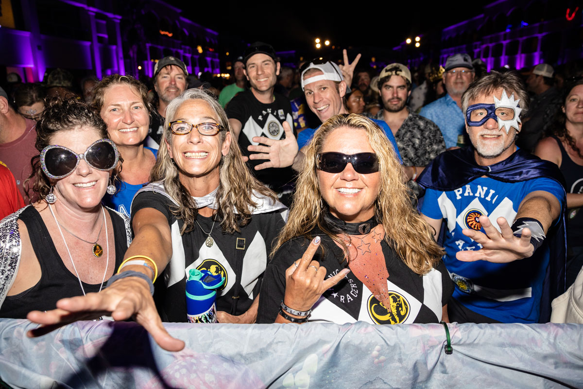 Guests posing in the crowd in theme night costumes
