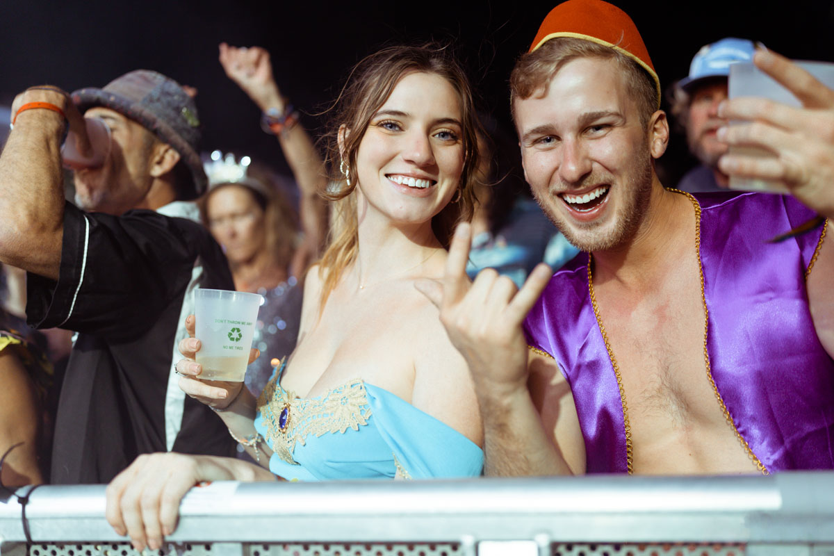 A couple posing together in theme night costumes.