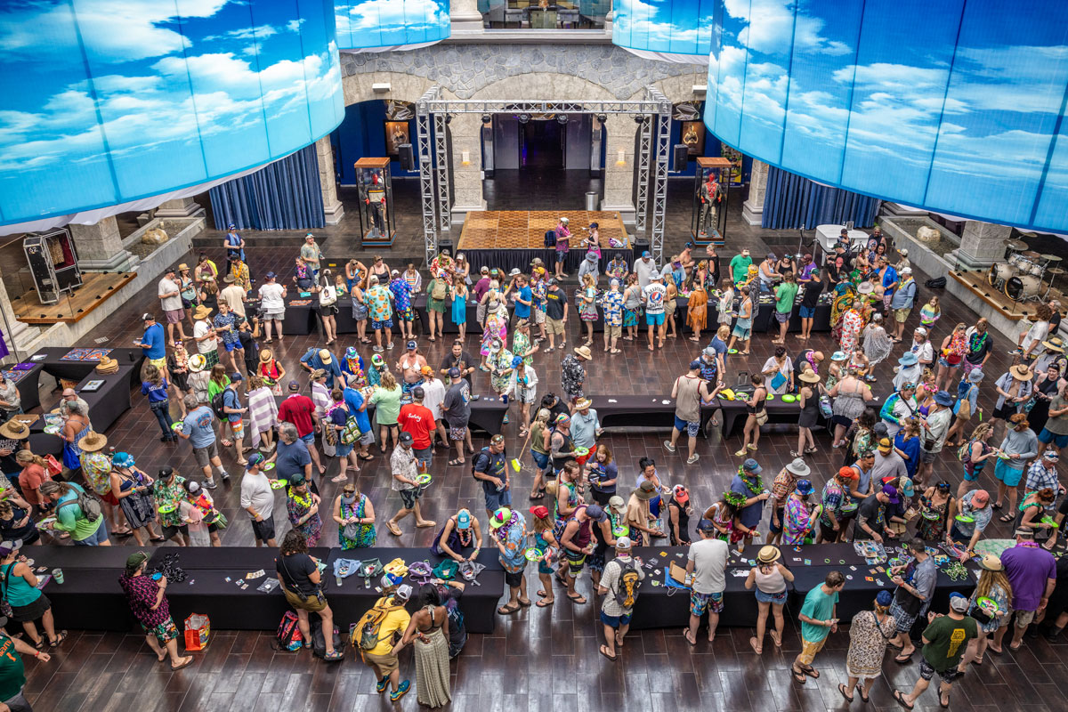 View from above of guests exchanging stickers during the Sticker Swap activity.