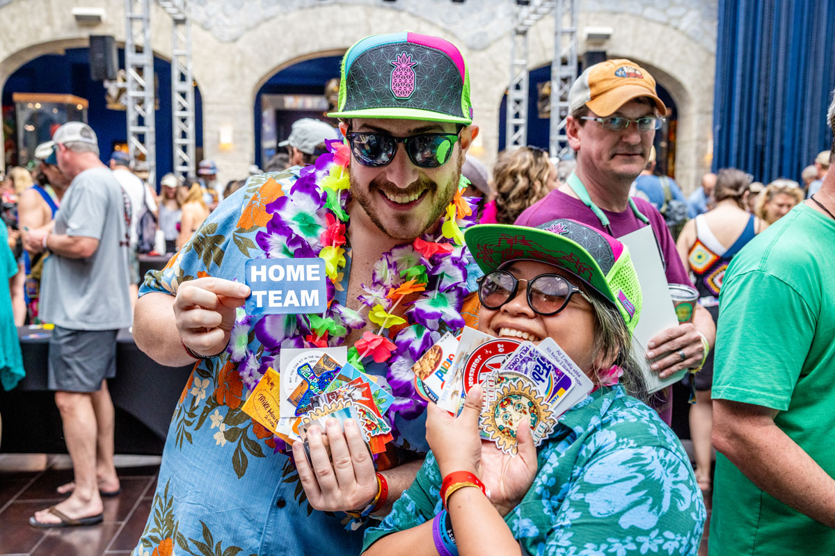 Guests posing with stickers during a Sticker Swap activity.
