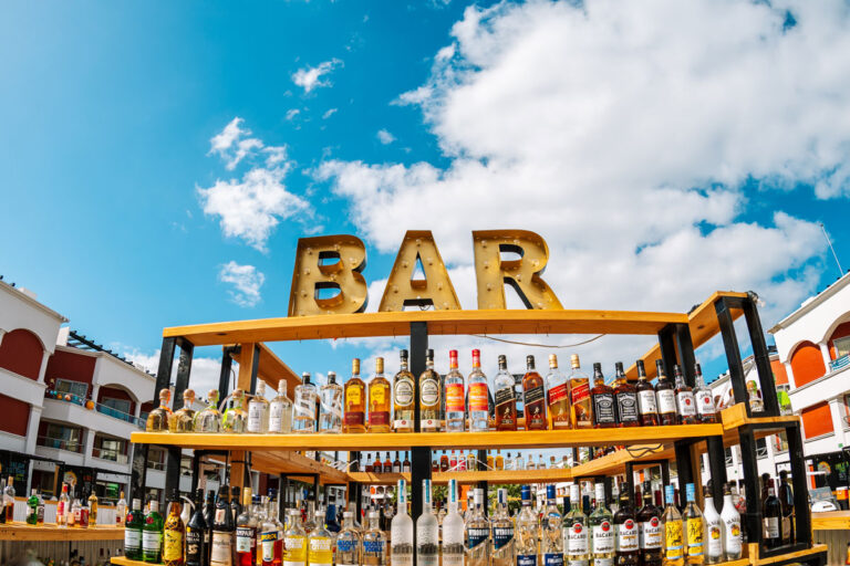 The concert courtyard main bar with a clear blue sky in the background.