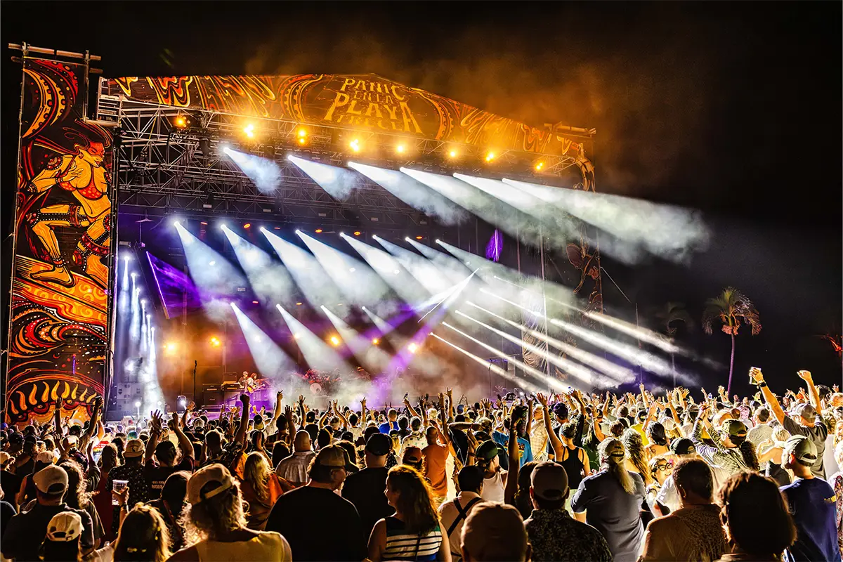 The Main Stage with bright lights shining towards the crowd.