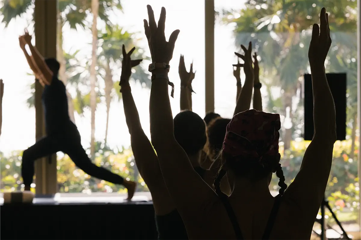 Guests participating in a group morning yoga session.