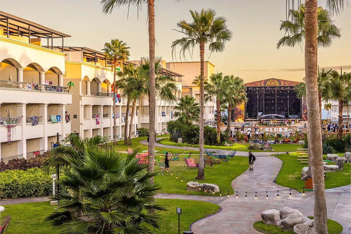 The concert courtyard during sunset with the main stage in the background.